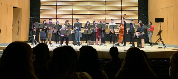 Clarinet students on stage with guest artists Light of East Ensemble in von Kuster Hall