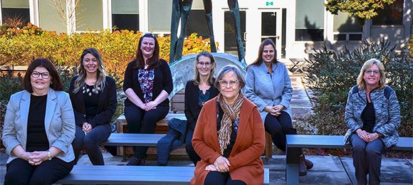 Photo of members of the Teacher Education Office seated outside.