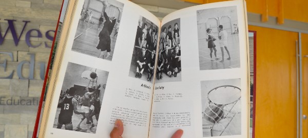 A photo of a Faculty of Education yearbook. Published in 1968, the yearbook's photos are in black and white and depict members of the Faculty's athletic society.