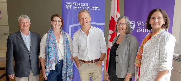 (From left) Terry Sheehan, parliamentary secretary to the minister of labour; Nicole Neil, Faculty of Education associate dean of research; Seamus O'Regan Jr., federal minister of labour; Barb MacQuarrie, community director for CREVAWC, and Adriana Berlingieri, research partner with CREVAWC.
