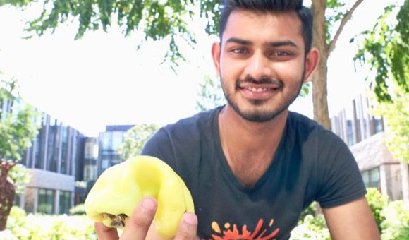 Food Fund organizer holding fruit