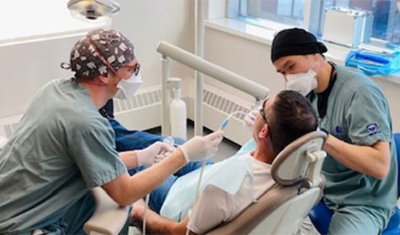 Schulich Dentists working on a patient